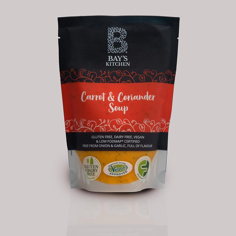 A packet of Bay's Kitchen Carrot & Corriander soup on a grey background