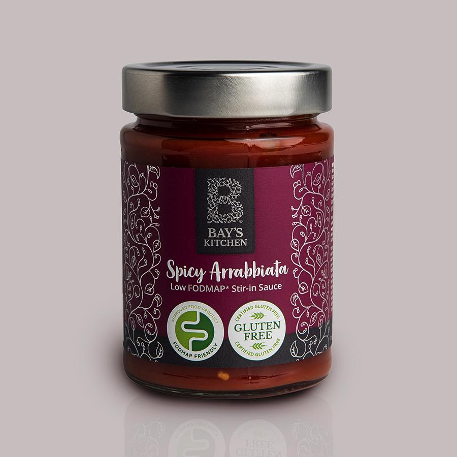 A jar of Bay's Kitchen Spicy Arrabbiata sauce on a grey background