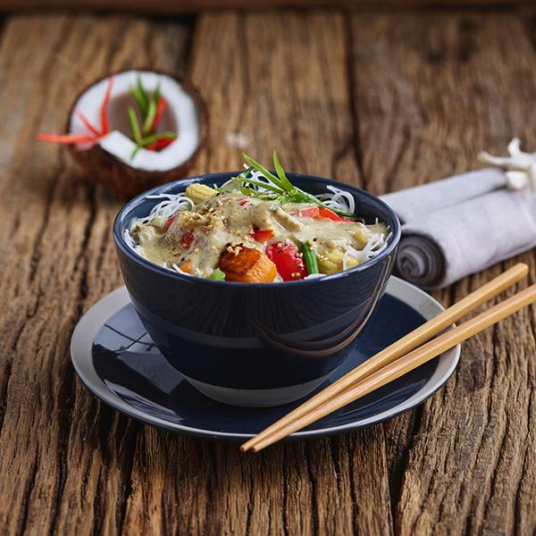 A bowl of vegetables and rice noodles made with Bay's Kitchen Thai Green Curry sauce