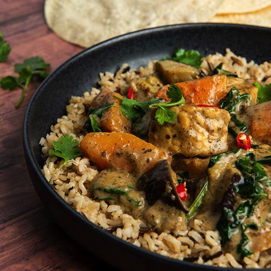 A bowl of vegetable curry made with Bay's Kitchen Thai Massaman sauce