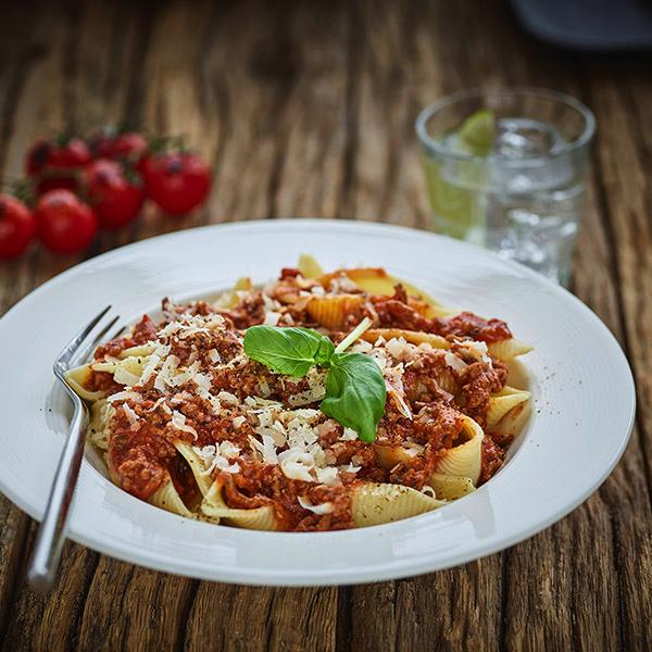 A bowl of spaghetti bolognese made using Bay's Kitchen award-winning Tomato & Basil sauce